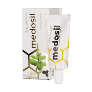 Biela tuba s nápisom "BIOMEDICA MEDOSIL včelí med kvetový pastový 30g" pred škatuľkou, obe s motívom plástu a zelenými rastlinami.