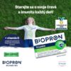 Žena leží na tráve s natiahnutými rukami, vedľa nej je krabička BIOPRON Imunita 30 kapsúl s vitamínom D. V slovenčine výzva, aby sme sa starali o svoju imunitu a črevá.