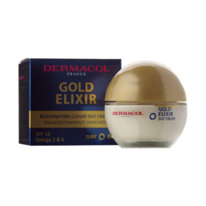 Vedľa krabičky je položený pohárik DERMACOL GOLD ELIXIR omladzujúci denný krém 50 ml.